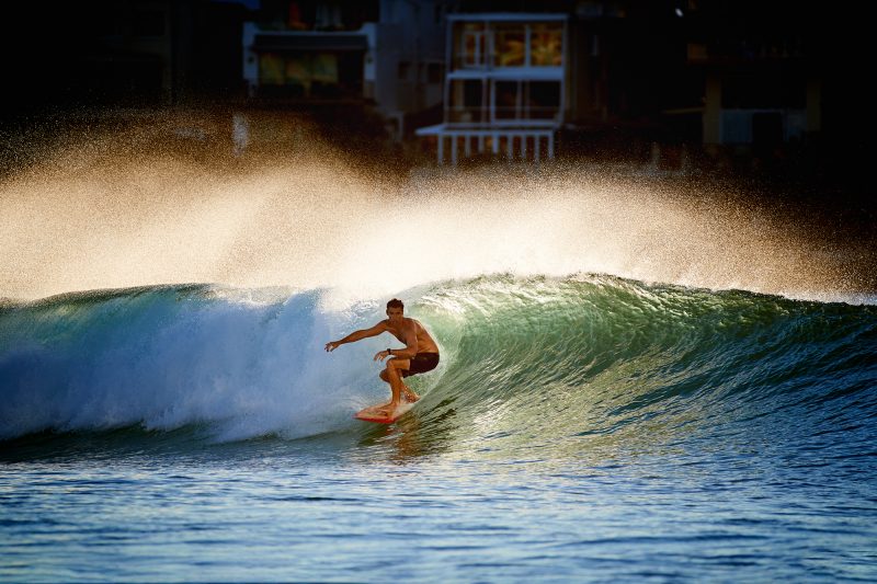 Chris Little, doused in morning golden light on a perfect peeler