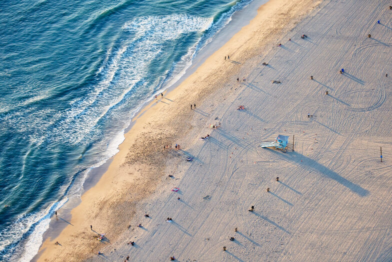 The beach is busy near the pier - but 100 yards away it's dead quiet