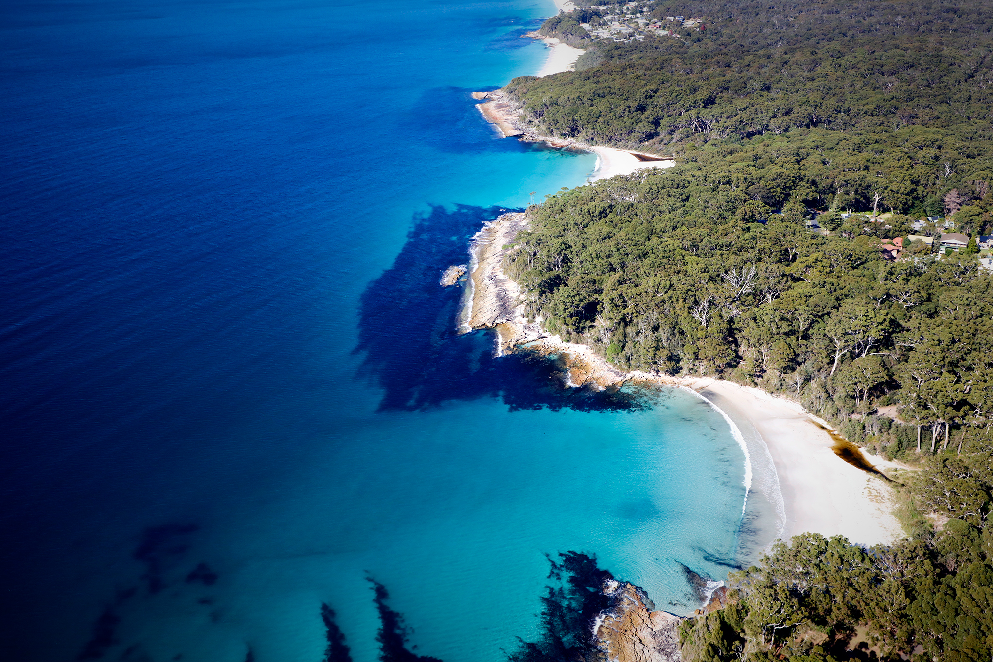 Yes, this place exists. Jervis Bay 3 hours south of Sydney