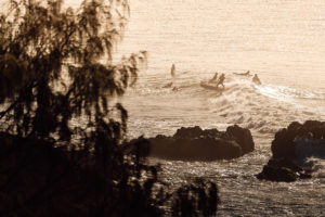 Taking off behind the rock, Byron Bay