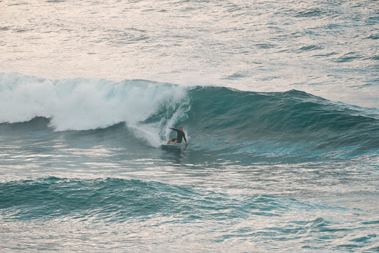 Ed Cunningham raking he leaves off the bottom at Bondi today